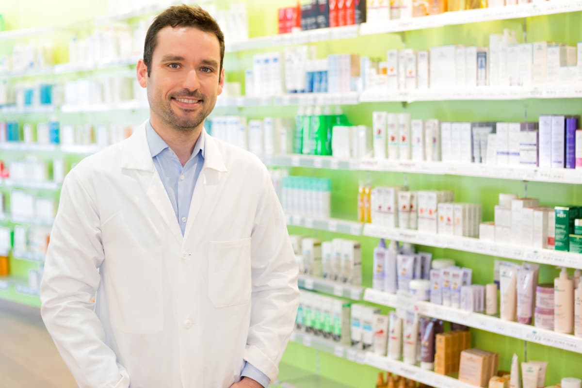 Portrait of an attractive pharmacist at work