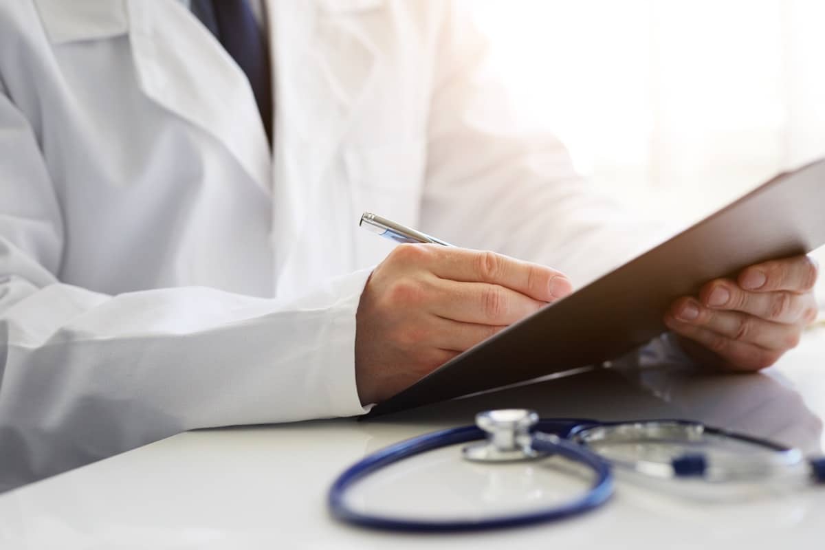 Male doctor sitting at desk